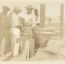 Page_37_1 Negritos Peru. Teaching others how to put on sucker rod guides